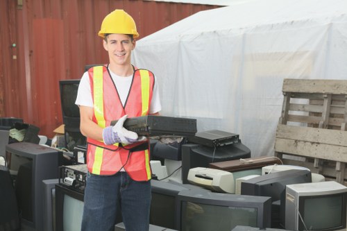 Workers recycling wooden furniture materials